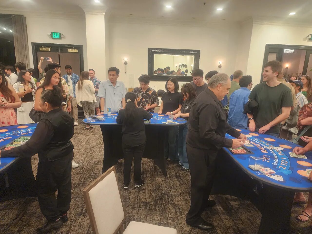 Birthday party crowd around a blackjack table at a Sacramento casino night