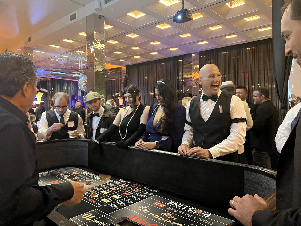 Professional dealers running a roulette table at a Sacramento casino party