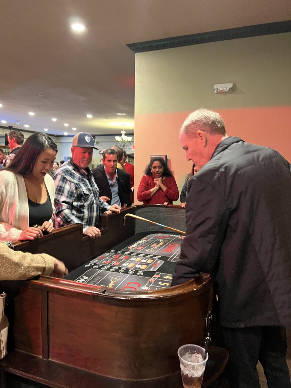 Guests gathered around the roulette wheel at a Sacramento casino party