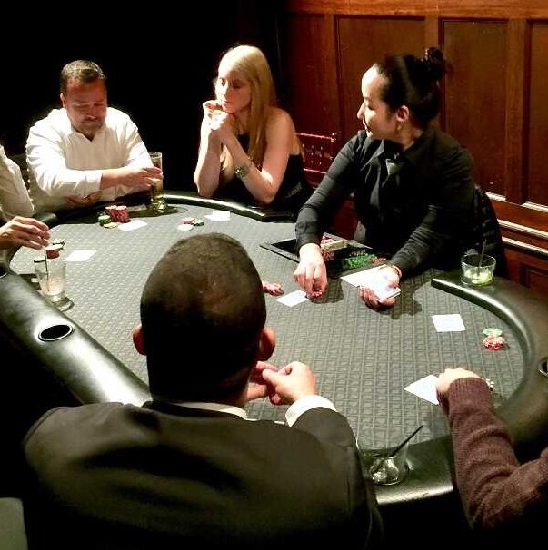 Players enjoying a poker table at an intimate Sacramento casino party