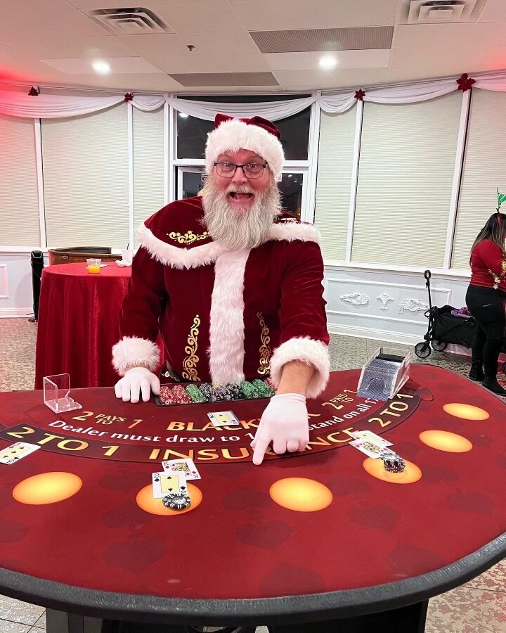 Santa dealing blackjack at a festive holiday casino party in Sacramento