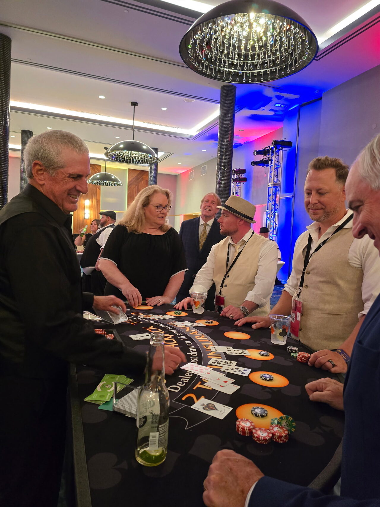 Guests playing blackjack at a Sacramento hotel ballroom casino party