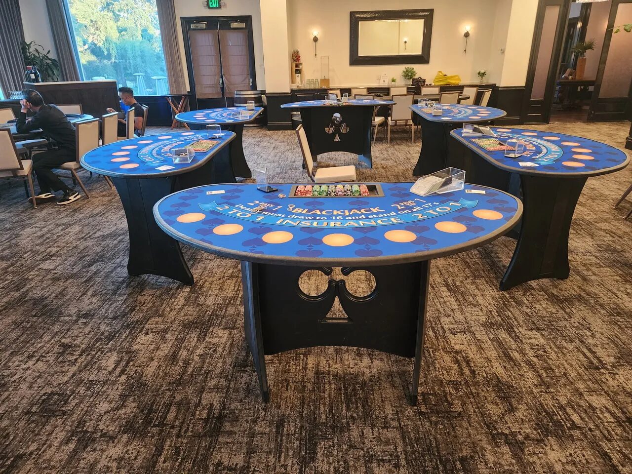 Rows of blackjack tables at a Sacramento fundraiser casino night